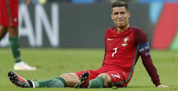 Football Soccer - Portugal v France - EURO 2016 - Final - Stade de France, Saint-Denis near Paris, France - 10/7/16 Portugal's Cristiano Ronaldo reacts after sustaining a injury REUTERS/Carl Recine Livepic